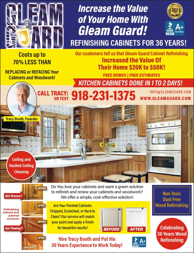 A beautiful kitchen with sparkling oak cabinets refinished by Gleam Guard.