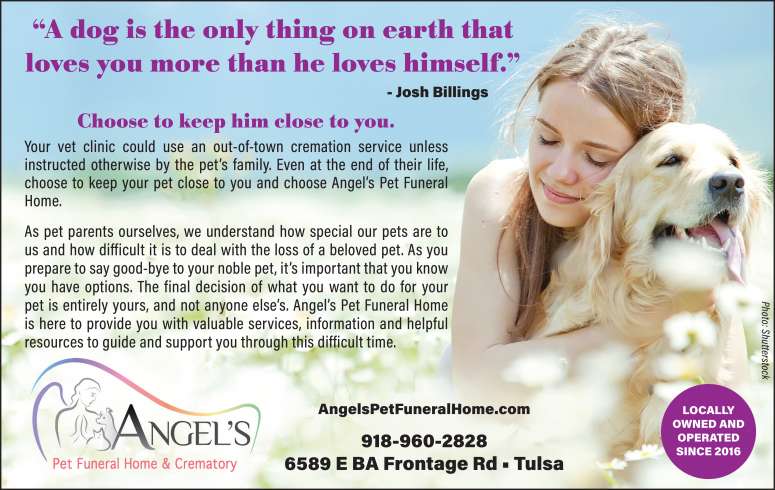A girl lovingly embraces her dog.