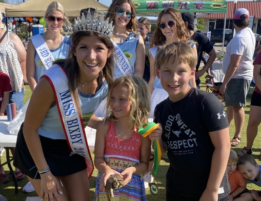 Miss Bixby 2022, Shay Sullivan, having some fun with the children at last year's festival.