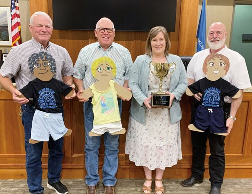 L to R: Pictured from left to right: Rogers County BOCC District 2 Commissioner Steve Hendrix; District 1 Commissioner Dan DeLozier; CASA of Northeast Oklahoma Executive Director Emily Bowling; and District 3 Chief Deputy Jon Brown. Photo courtesy of Diana Dickinson, Rogers County Public Information Officer, July 2026.