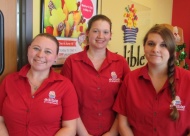 Pictured left to right: Edible Arrangement store managers include Brandi Nix from the 91st and Memorial store, Morgan Skaggs from the the Owasso store,  and Natalie Hawkins from the 33rd & Peoria store.