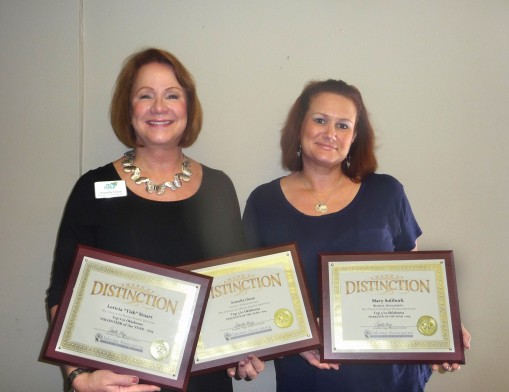 Armella Glenn and Tricia Holland, Staffing Director, hold the plaques My Choice In Home Senior Services recently received from the Oklahoma Association for Home Care and Hospice.