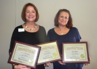 Armella Glenn and Tricia Holland, Staffing Director, hold the plaques My Choice In Home Senior Services recently received from the Oklahoma Association for Home Care and Hospice.