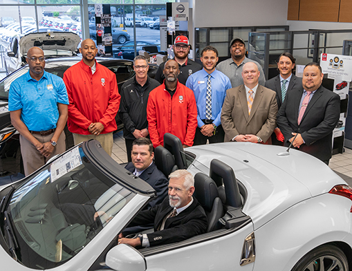 The Route 66 Nissan of Tulsa Executive Team, featuring (seated) Chuck Mulkey, Executive Manager and Matthew Bates.  (standing left to right): Marcus Childs, Angelo Estes, Todd Williams, Ray Asberry, Landon Bush, Jeremy Stafford, William Childs, and David Pope.