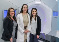 Dr. Terry Styles (center) and board-certified radiation therapists Robin Mixon (left) and Kacie Morris (right) with one of the clinic’s most effective pieces of equipment, the Varian Halcyon treatment system.
