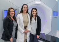 Dr. Terry Styles (center) and board-certified radiation therapists Robin Mixon (left) and Kacie Morris (right) with one of the clinic’s most effective pieces of equipment, the Varian Halcyon treatment system.