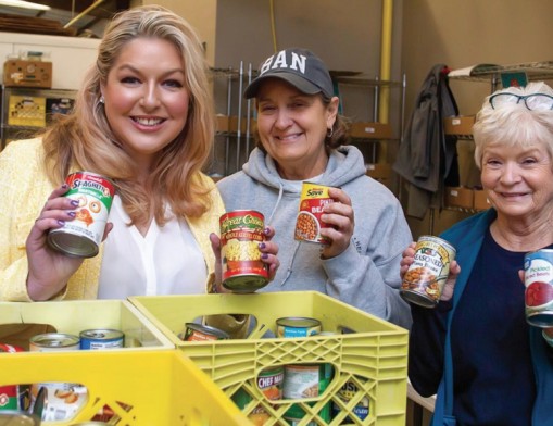 Megan Quickle, Executive Director with weekly volunteers, Paula Torrence and Mary Thomason, sorting food drive donations from the public.