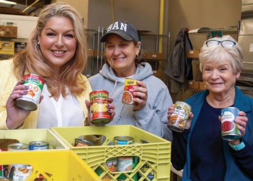 Megan Quickle, Executive Director with weekly volunteers, Paula Torrence and Mary Thomason, sorting food drive donations from the public.