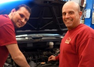 Owasso Auto Care Owner Tim Miller checks on progress of a job with Auto Specialist David Figart.  The shop provides services for virtually all vehicles including older cars and hot rods.