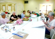 Tulsa Herb Society members meet throughout the year to craft items for Carols and Crumpets.