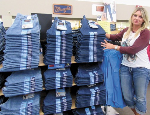 Senior Buyer Leigh Ann Offield shows the newest denim with cooling technology.