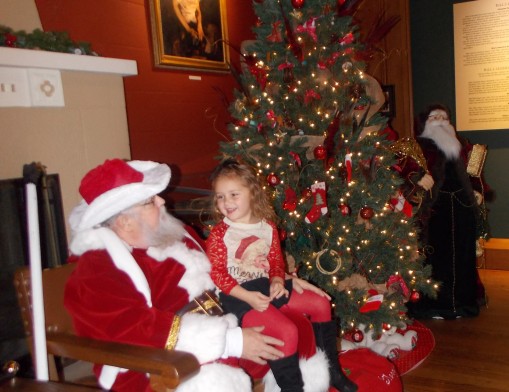 ﻿Emmery Faith Pease pays a visit to Santa at the Will Rogers Memorial Museum. Santa will return this year for photo sessions (use your own camera) from 11 a.m. to 2 p.m. on Saturdays Dec. 2, 9, and 16. Admission is free to the Museum for the photo
sessions.