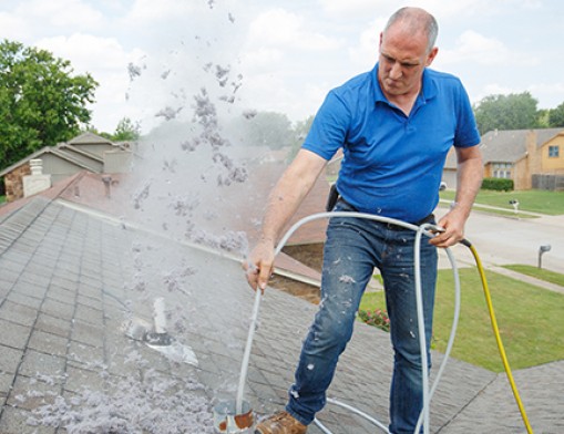 David Harris is a 3rd generation professional air duct and dryer vent cleaner.  Here he is cleaning away massive amounts hazardous dryer vent debris. Value News Magazine & Values, Inc photos, July 2024.