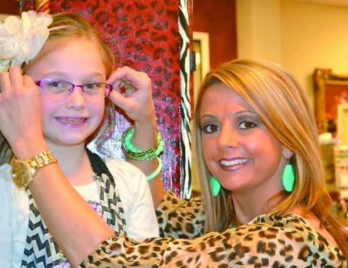 Dr. Abby Overstreet-Hogle with a young patient, Alexa.