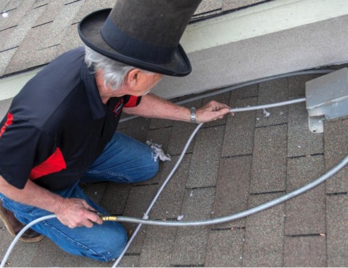 David Harris, Sr., owner of Black Hat Cleaning Services, specializes in cleaning lint and debris clogged dryer vents.