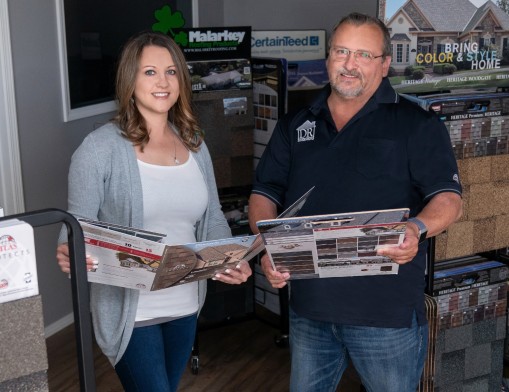 Office manager Amber Murr-Hazelwood (left) and her father Jim Murr (right), president and owner, of Dun-Rite Roofing.