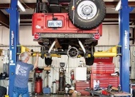 Lead Mechanic & Pro Vehicle Problem Solver Jay Peary is shown working on a Jeep.
Photo by TG Photography