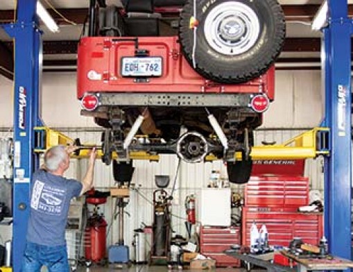 Lead Mechanic & Pro Vehicle Problem Solver Jay Peary is shown working on a Jeep.
Photo by TG Photography