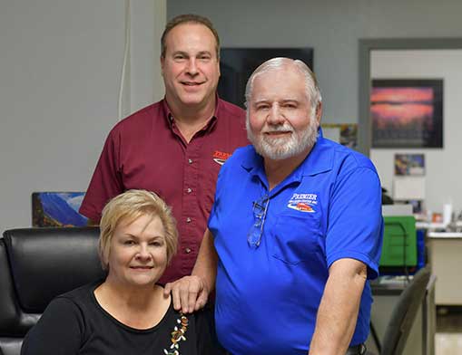 Fay Higinbotham, and owners Monte Whitaker and Ralph Higinbotham.