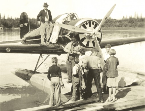 Will and Wiley August 1935 Wiley Post in the cockpit and Will Rogers on the wing in Alaska as they prepare to take off.