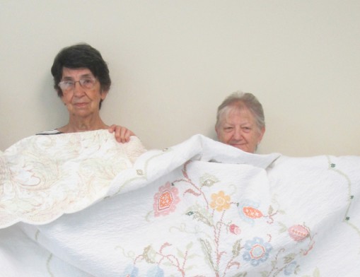 Members of Gamma Pi ESA hold the quilt that will be given at the 9th annual Bunco tournament.
 (L to R): Karla Applegate, Bobbi Martin, Janie Stevens and Gertrude Riddle.