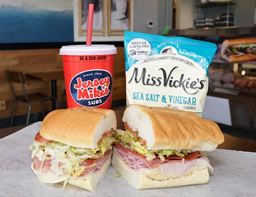 Subs ordered “Mike’s Way” are piled high with onions, tomatoes, vinegar, oil, and a special mix of spices. Make it a meal with Vickie’s chips and a drink!