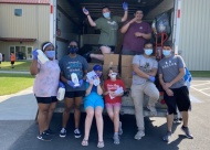The youth volunteers’ desire to serve those in need is unrelenting, through May, through June, now July and through rainstorms and near 100-degree heat. The Abiding Harvest Youth Grocery Giveaway each Wednesday has a line of waiting cars winding through the parking lot and out into the street.