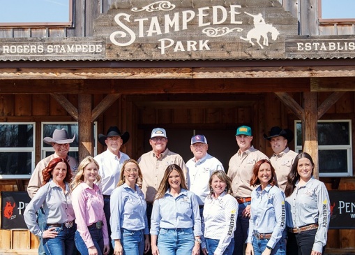 Back L to R: Will Rogers Stampede Rodeo Chairman David Petty, John Feary, Marshall Perkins, Dan Delozier, Alex Pegorsch, and Jason Goins. Front L to R: Karen Hanson, Will Rogers Stampede Rodeo Junior Committee Chair Spencer Wilson, Allison Dietzfeld, Sarah Hayes, Miranda Stelzer, Samantha Wilson, and Will Rogers Stampede Committee Chair Erin Pegorsch. Value News VN Magazine and Values Inc. photo, May 2026.