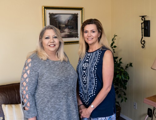 Century Title of Oklahoma owner Sharon Mixon (left) and closer Sabrina Nelson (right).