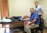 Sequoyah High School soccer player Megan Oldashi is examined by Dr. Steven Hardage (seated), as Physician Assistant Isaac Bethea watches. Claremore’s Eastern Oklahoma Orthopedic Center is once again offering Saturday morning sports injury clinics to see patients who have been injured in Friday night play.