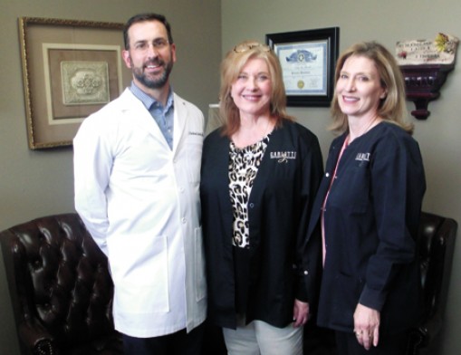 Dr. Andrew Carletti, Administrator Norma Tyler and Karen Summers offer a hands-on approach to training dental assistants.