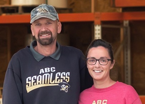 Ed and Leanna Yoder with their children are pictured inside their expansive materials warehouse.