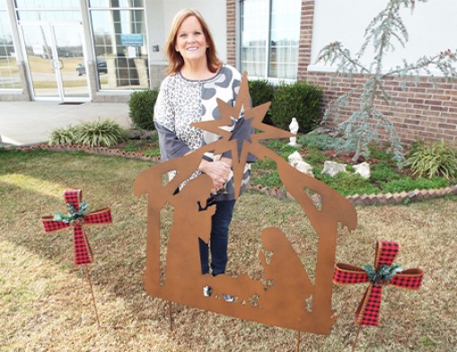 Mission Outreach Coordinator Karla Yates stands outside Oologah UMC while preparing for a special Christmas event for the community.