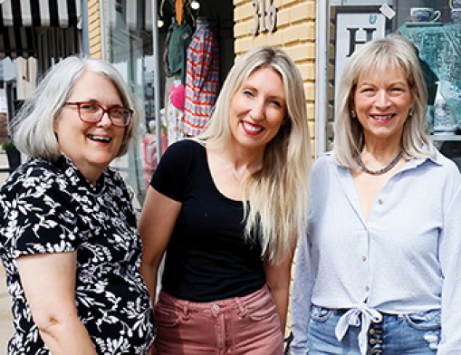 Claremore Main Street board members Anita Miller, Jamie Peckham, and Susan Gebhart are involved in planning the Lilac Festival. Value News and Values, Inc. photo, April 2025.