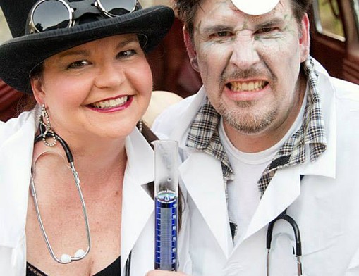 Melanie Hasty-Grant and husband Ken Grant dressed as Dr. Jekyll and Mr. Hyde at their 2014 Halloween Haunted Mansion, sponsored each year by Waterstone Private Wealth Management.