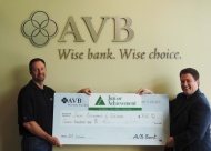 AVB Bank President and CEO, Ted Cundiff, presents a $750 donation to Junior Achievement (JA).
