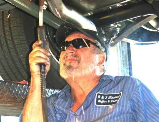 B&S Muffler expert Jerry Phillips puts a weld on a new exhaust system on a custom hotrod truck.  Jerry has been with B&S Muffler for years and has a very 
loyal following.