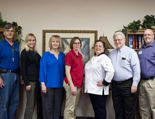 The staff of Prairie Rose is dedicated to serving their residents in an active community. Pictured left to right: Maintenance, Paul Lewis; Enrichment Coordinator, Sheila Sampley; Executive Chef, Krysie Robinson; Sales Leader, Laura Chaney; Assistant General Manager, Jim Forrest; General Manager, Matthew Randall and Office Manager, Crickett Forrest.