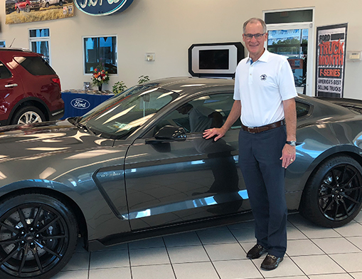 Steve Kissee with a Shelby GT 350 Mustang.