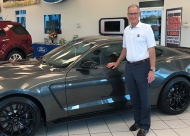 Steve Kissee with a Shelby GT 350 Mustang.