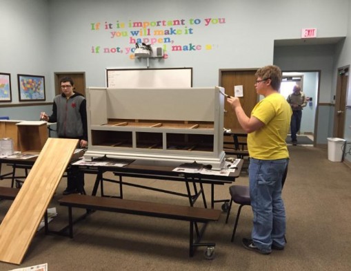 Students at the U-Turn Academy show off the recycled furniture project they are working on for the annual Chair-ity Auction. Make sure you attend February 5th for the chance to bid on this one of a kind item.