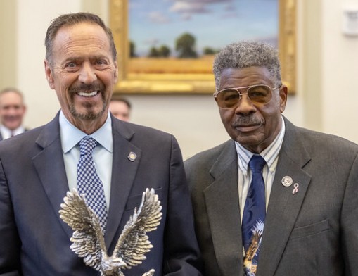 The Oklahoma Veterans Council presented Luttrell (left) with the Representative of the Year Award. Pete Peterson, Chairperson of the Oklahoma Veterans Council, presented the award.