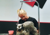 Kelly McKinney treats a happy customer to to a nail trim.