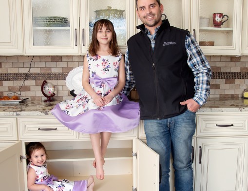 Austin Gullic and his girls inside the Premium Cabinets showroom