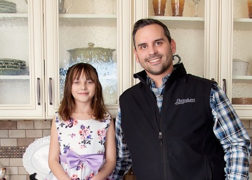 Austin Gullic and his girls inside the Premium Cabinets showroom