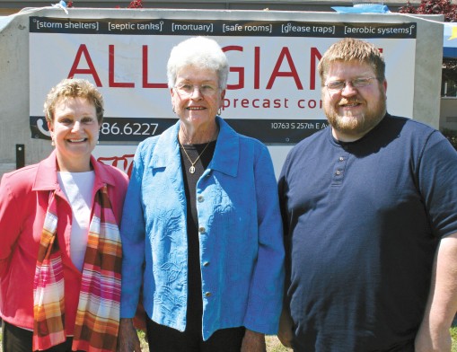 Broken Arrow Senior Center employees Ami Bucher and June Ross are shown with Allegiant Operations Manager Jeremy Street and the in-ground Allegiant Storm Shelter that will be awarded to the holder of the winning ticket in the annual Senior Center fundraiser.