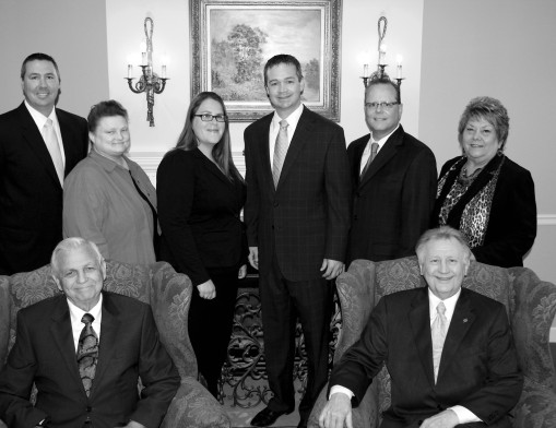 The staff of MMS-Payne Funeral Home & Cremation Service (L to R): (Seated) Charlie Bray and Frank Friedemann, (Standing) Frank Klucevsek, Susan Bickford, Denise Adamson, Ryan Payne, Allen McElwain, and Sharon Moody.