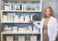Olga Arnold displays some of the many great skin care product lines at Skin Ambitions Medical Spa.