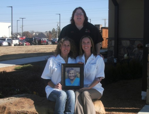 Doctors Gena Guerriero andJenny Nobles with Lead Receptionist Marianne pay tribute to Wanda, a founding employee at the office.