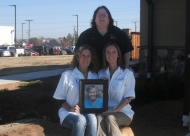 Doctors Gena Guerriero andJenny Nobles with Lead Receptionist Marianne pay tribute to Wanda, a founding employee at the office.